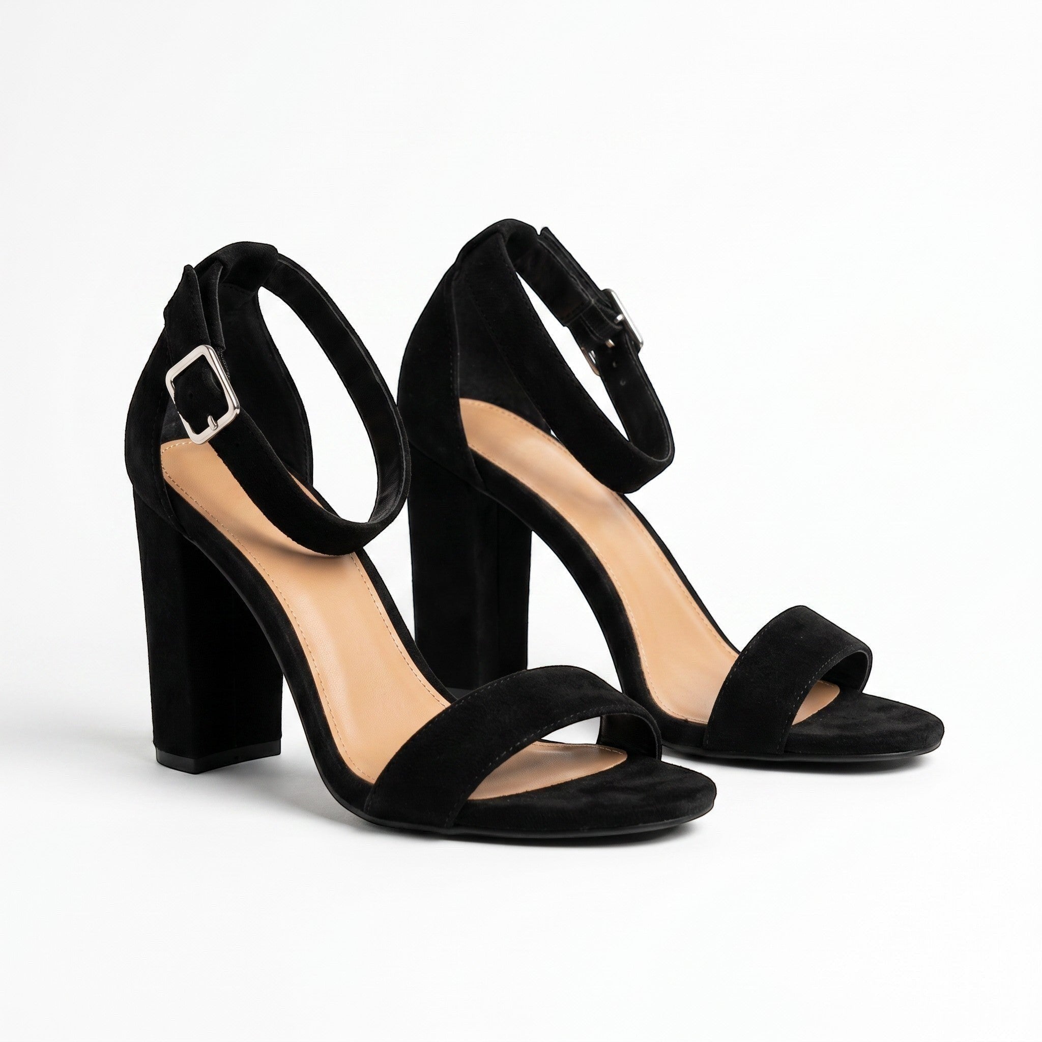 Somethinguluv3 black velvet ankle strap block heel sandals with silver buckles and 4-inch chunky heels.