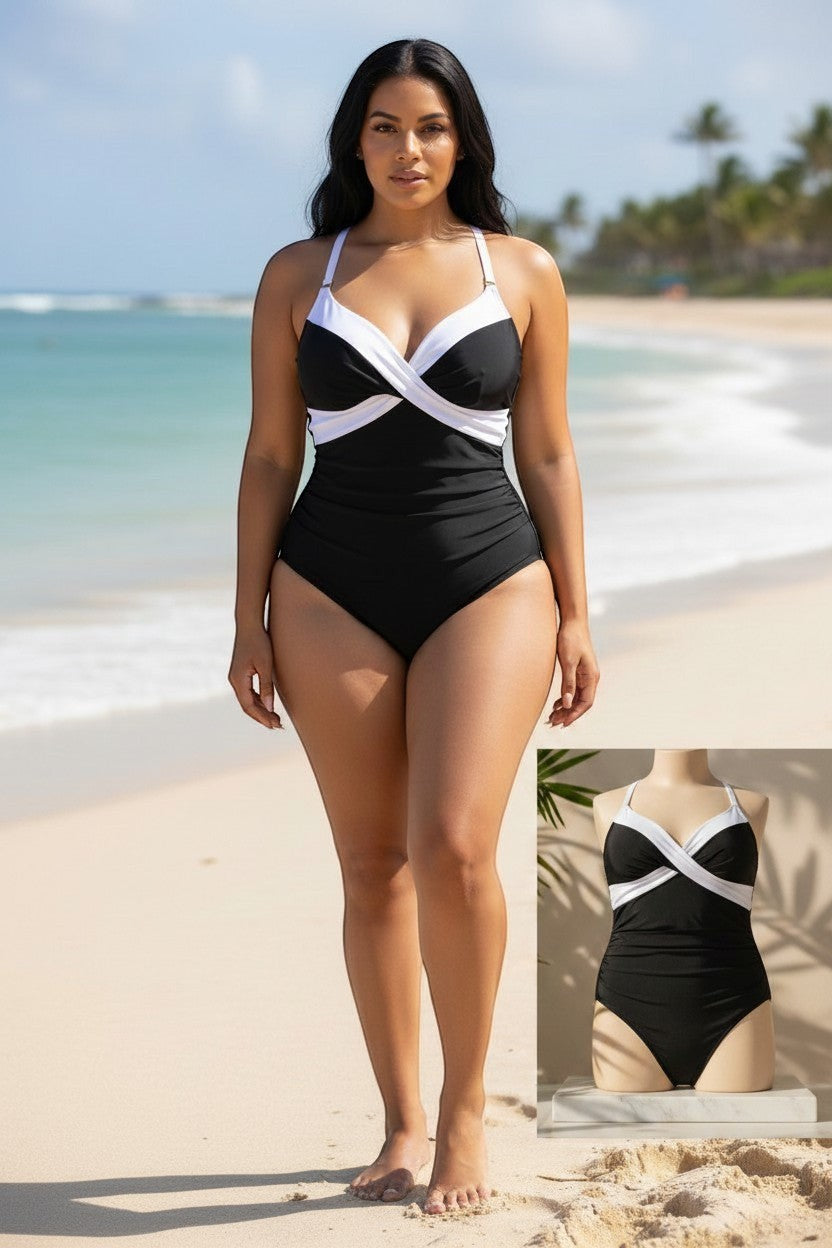 Somethinguluv3 black and white tuxedo slimming swimsuit with a flattering wrap-style bust on a model at the beach.