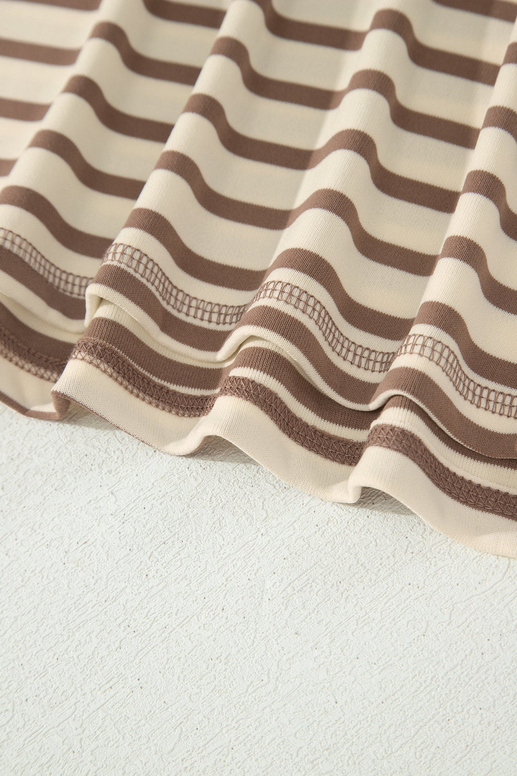 Somethinguluv3 brown and cream striped fabric detail of a plus size casual top and shorts set