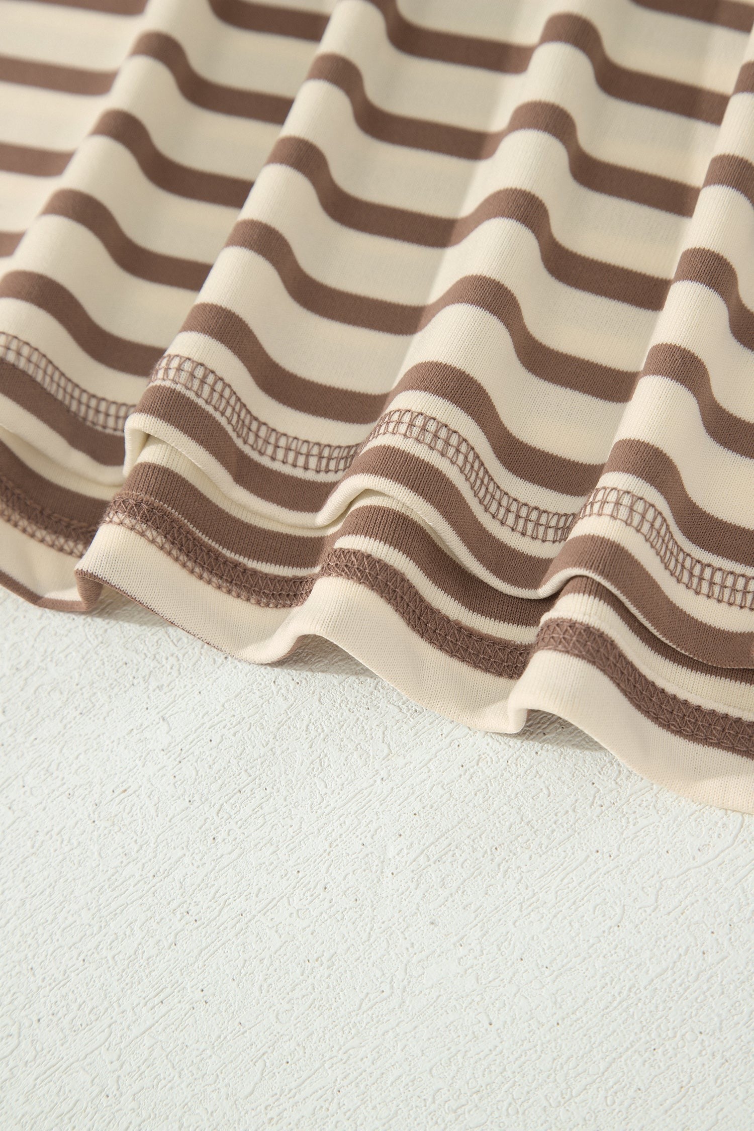 Somethinguluv3 brown and cream striped fabric detail of a plus size casual top and shorts set