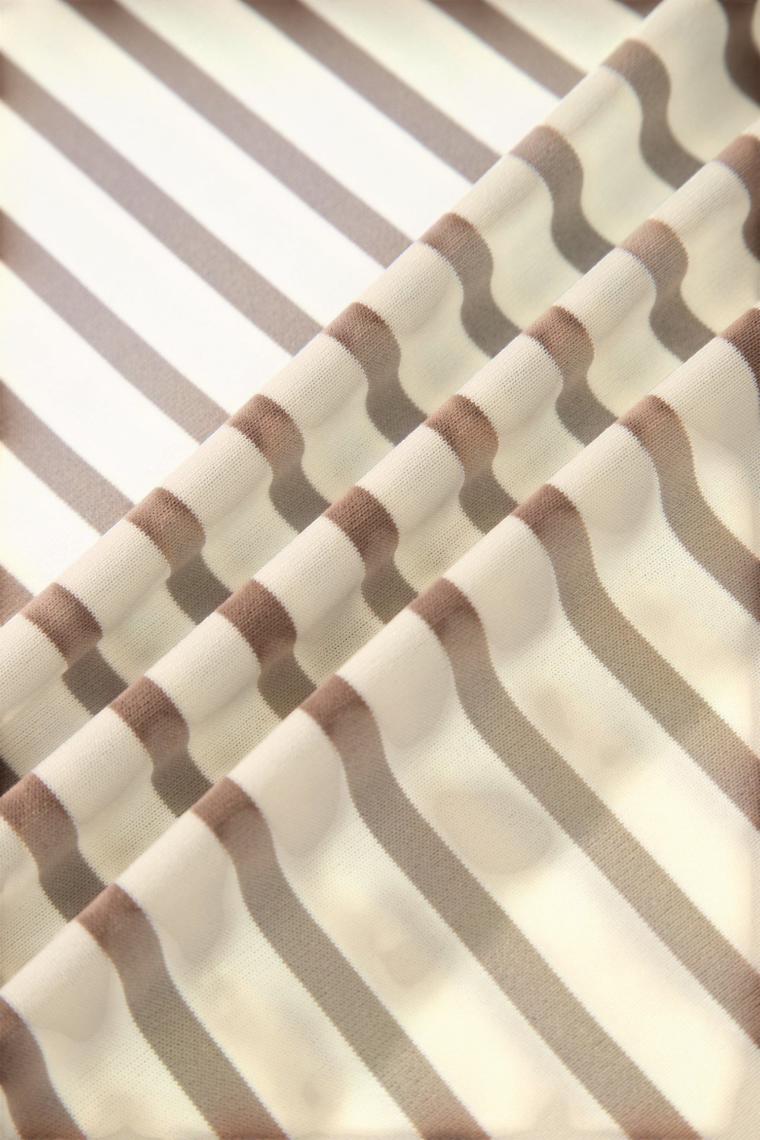 Somethinguluv3 brown and white striped fabric close-up showing soft texture of the casual top and shorts set