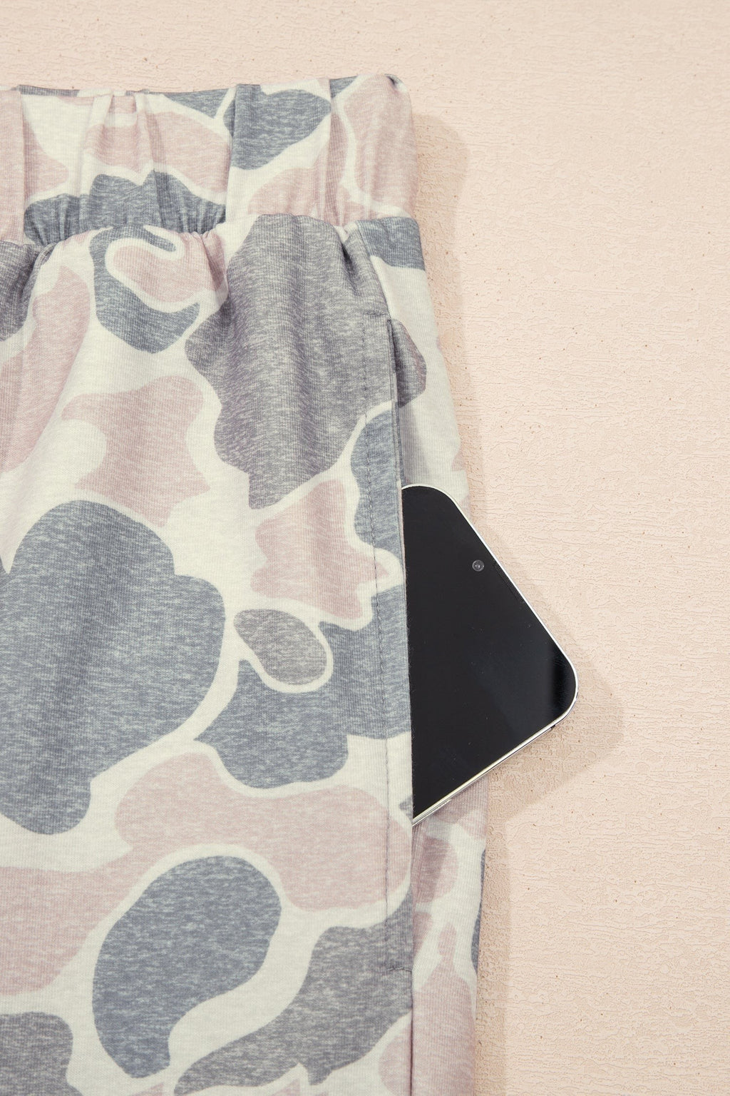 Somethinguluv3 lounge set trousers in a muted pink and grey camouflage print featuring a functional side pocket