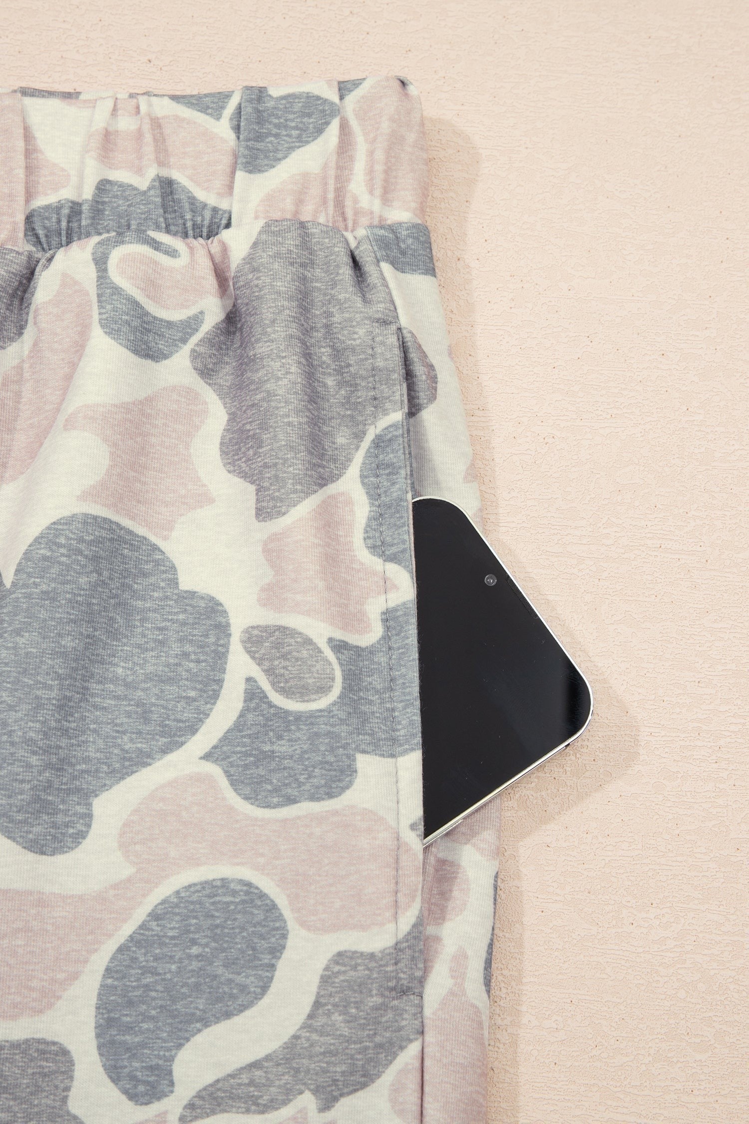 Somethinguluv3 lounge set trousers in a muted pink and grey camouflage print featuring a functional side pocket