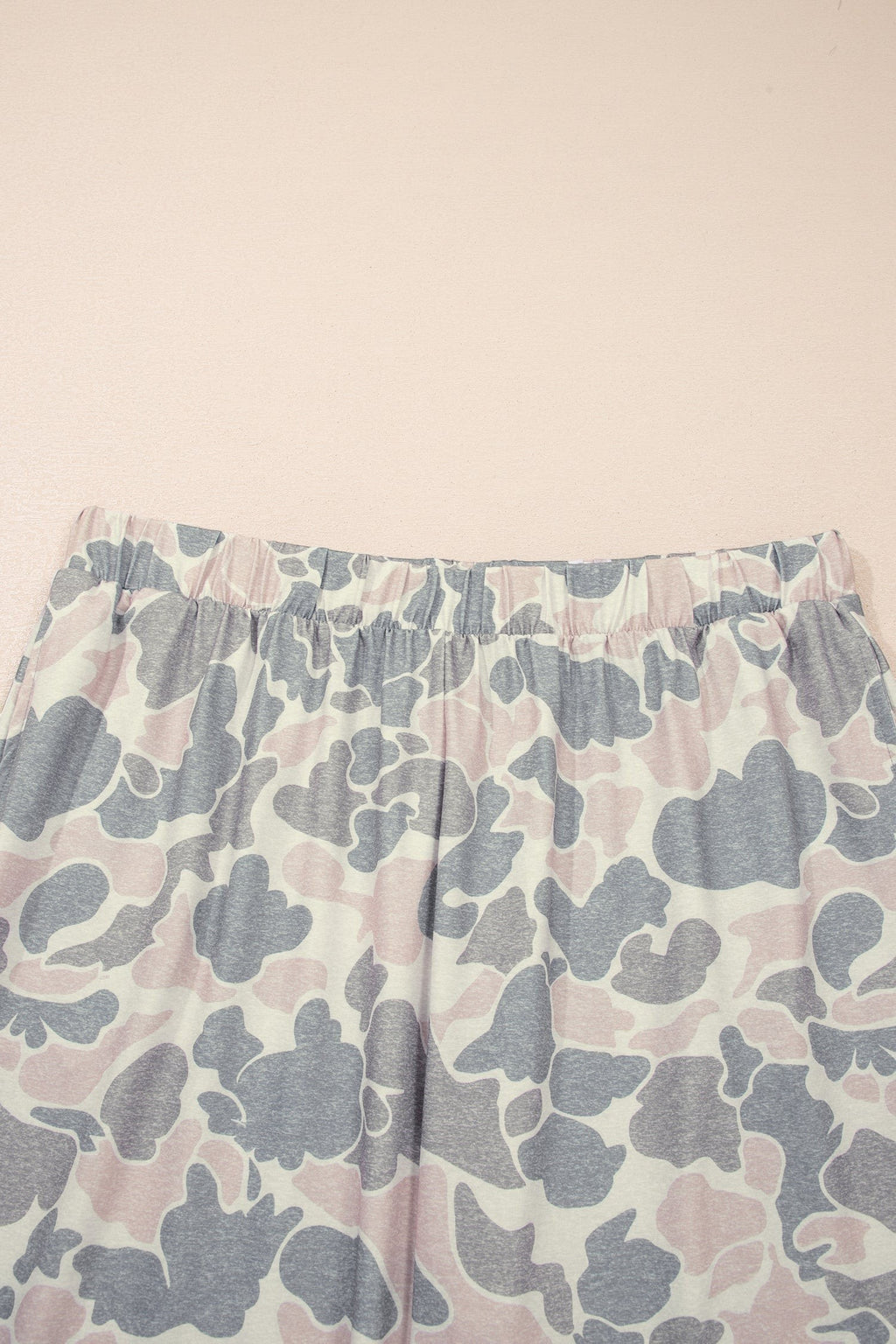 Somethinguluv3 lounge set pants featuring a muted pink and grey camouflage print with a comfortable elastic waistband.