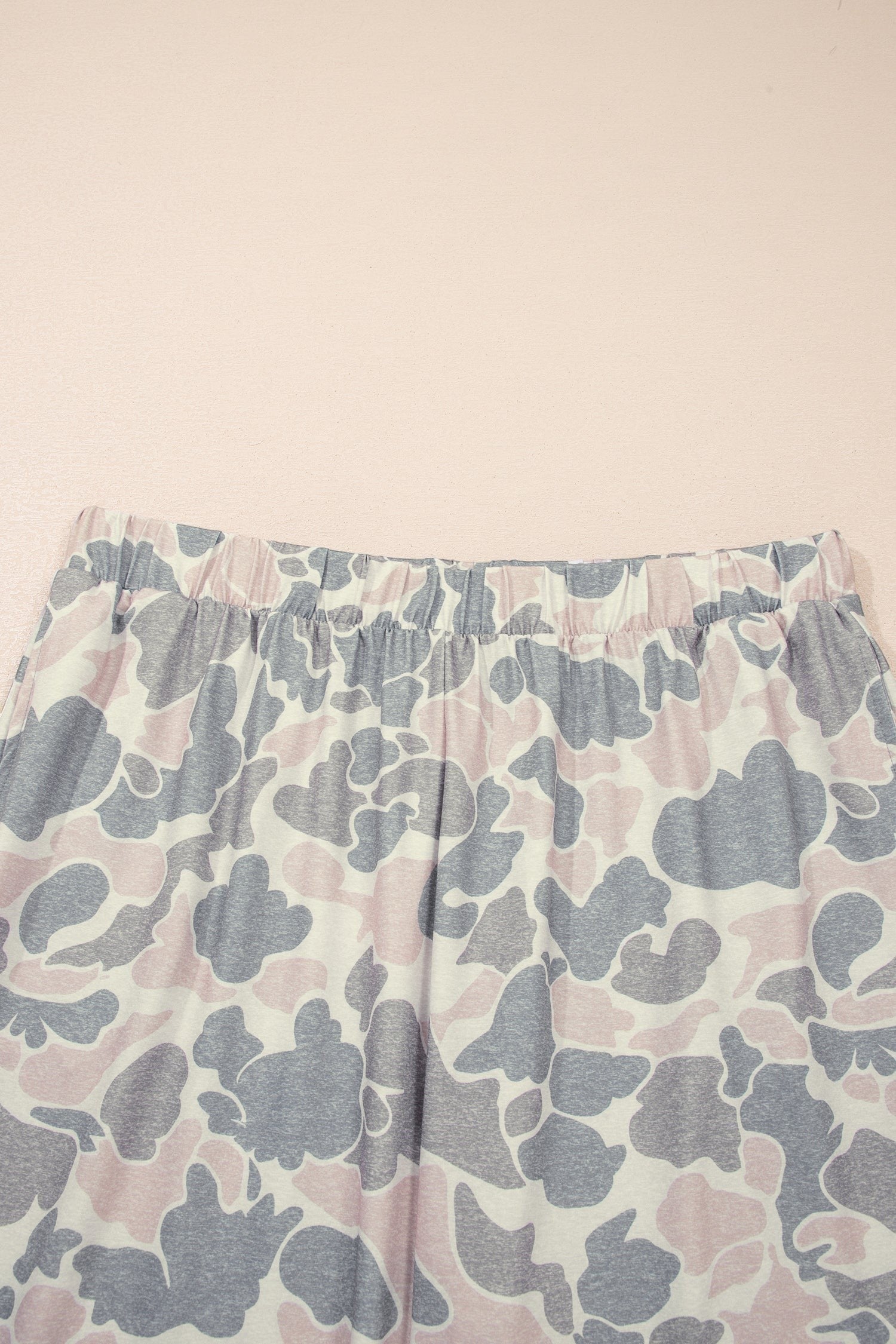 Somethinguluv3 lounge set pants featuring a muted pink and grey camouflage print with a comfortable elastic waistband.