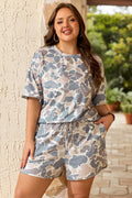 Somethinguluv3 plus size casual set featuring a multicolour camouflage print tee and matching drawstring shorts.