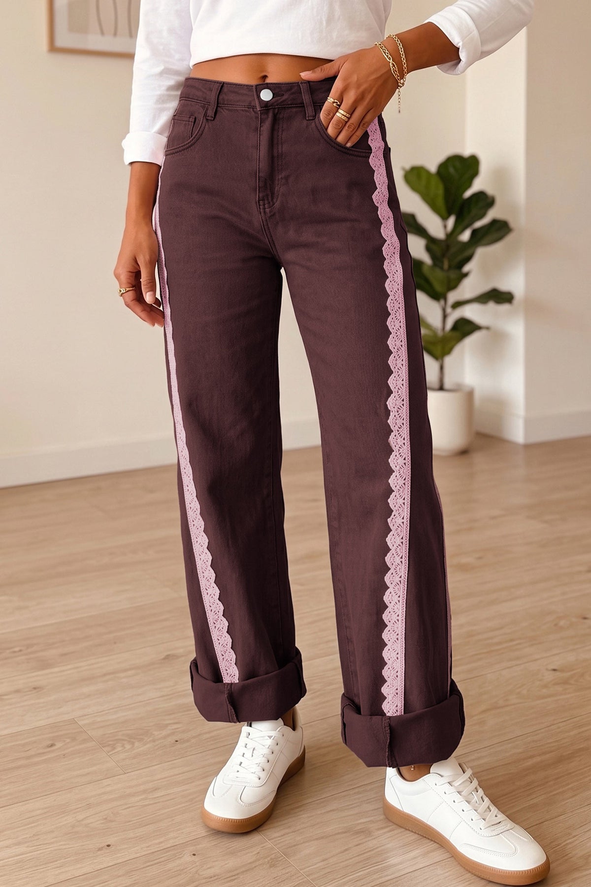 Somethinguluv3 coffee brown denim jeans featuring boho-style pink lace side trim and rolled cuffs on a model.