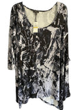 Somethinguluv3 Cupio black and white abstract print tunic top with a scoop neckline and asymmetrical hem.