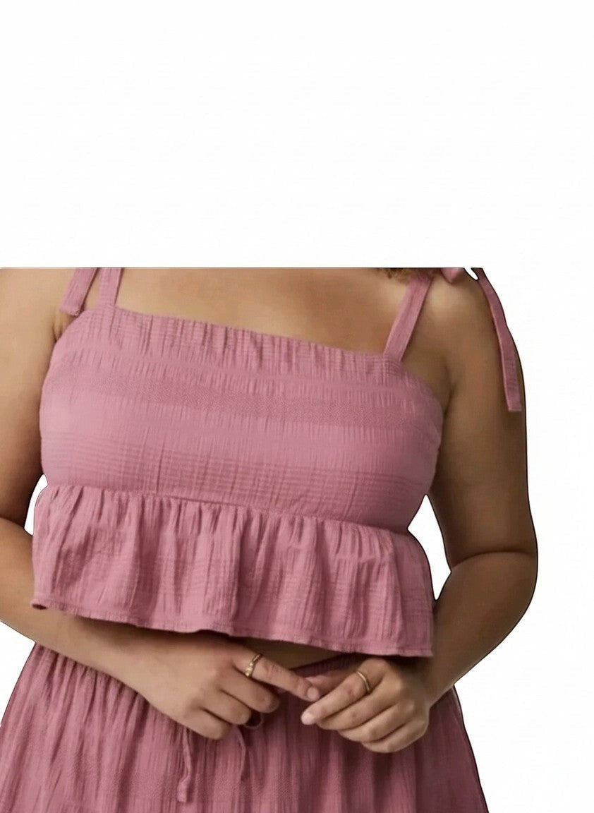 Somethinguluv3 dusty rose textured crop top with square neckline, adjustable tie straps, and a playful ruffle hem.