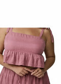 Somethinguluv3 dusty rose textured crop top with square neckline, adjustable tie straps, and a playful ruffle hem.