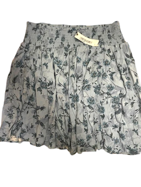 Somethinguluv3 light blue mini skirt with a dark floral print and a comfortable smocked waistband.