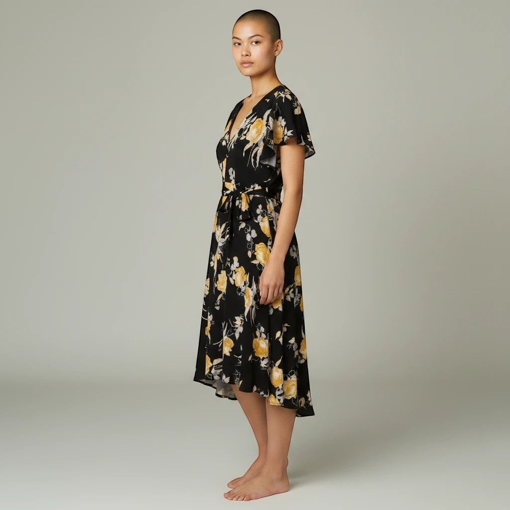 Somethinguluv3 Lane Bryant black floral midi dress with flutter sleeves, V-neck, and asymmetrical hem on a model