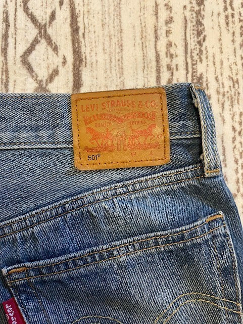 Somethinguluv3 Levis 501 medium wash denim shorts with iconic tan leather brand patch on the back waistband
