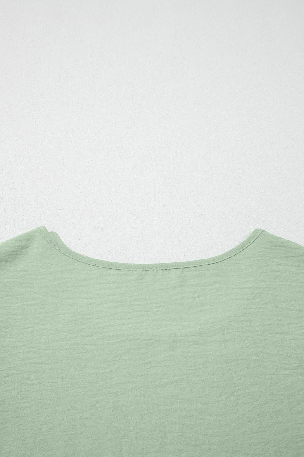 Somethinguluv light green round neck blouse with textured fabric detail