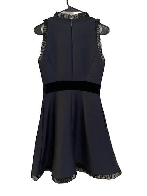 Somethinguluv3 navy blue sleeveless fit and flare dress with velvet bow detail and ruffled neckline. Polyester blend.