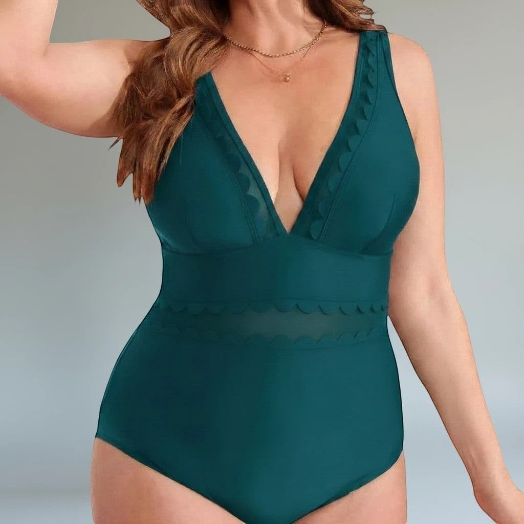 Somethinguluv3 plus size teal one-piece swimsuit with a deep V-neckline, scalloped edges, and a mesh waist panel.