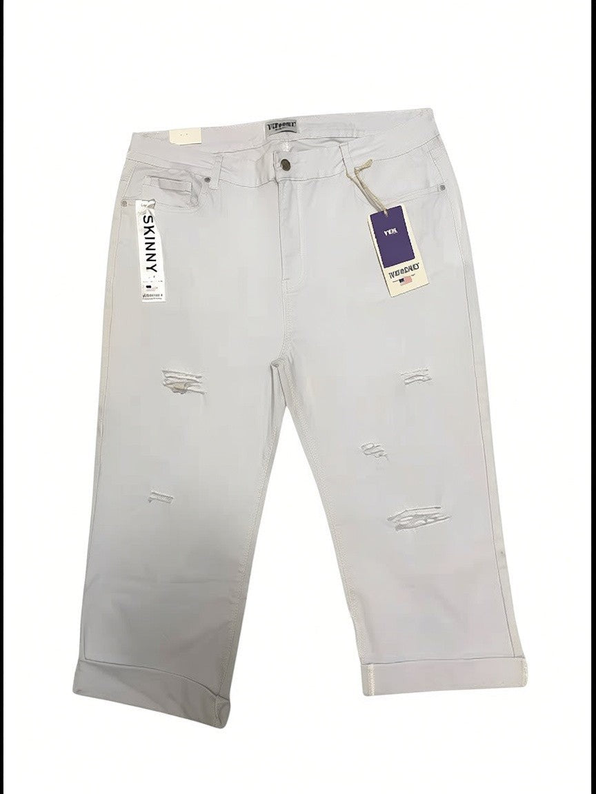 Somethinguluv3 white distressed skinny fit cropped denim capris with rolled cuffs and brand tags attached.